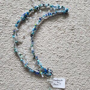 Sun catcher, handmade with crystals, wired on metal frame. 8.5x3in.